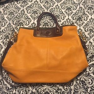 Mustard shoulder used dooney and Burke purse